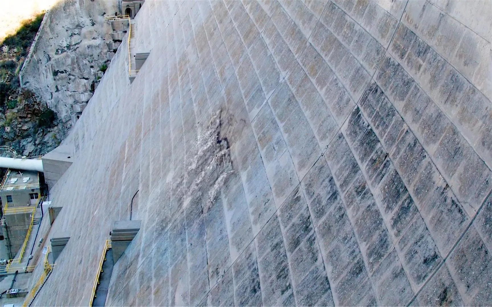 Concrete dam and inspection infrastructure